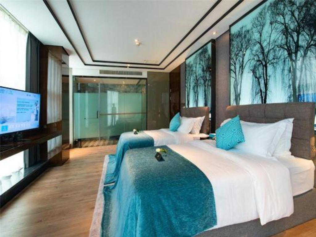 Xana Hotelle-Hotel Luzhou Baizitu Square Bagian luar foto