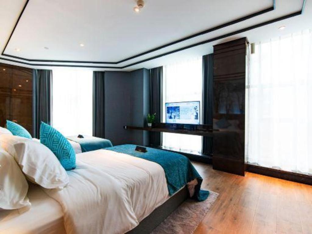 Xana Hotelle-Hotel Luzhou Baizitu Square Bagian luar foto