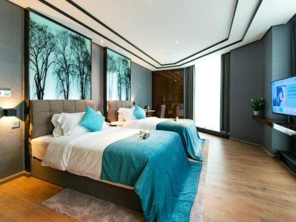 Xana Hotelle-Hotel Luzhou Baizitu Square Bagian luar foto